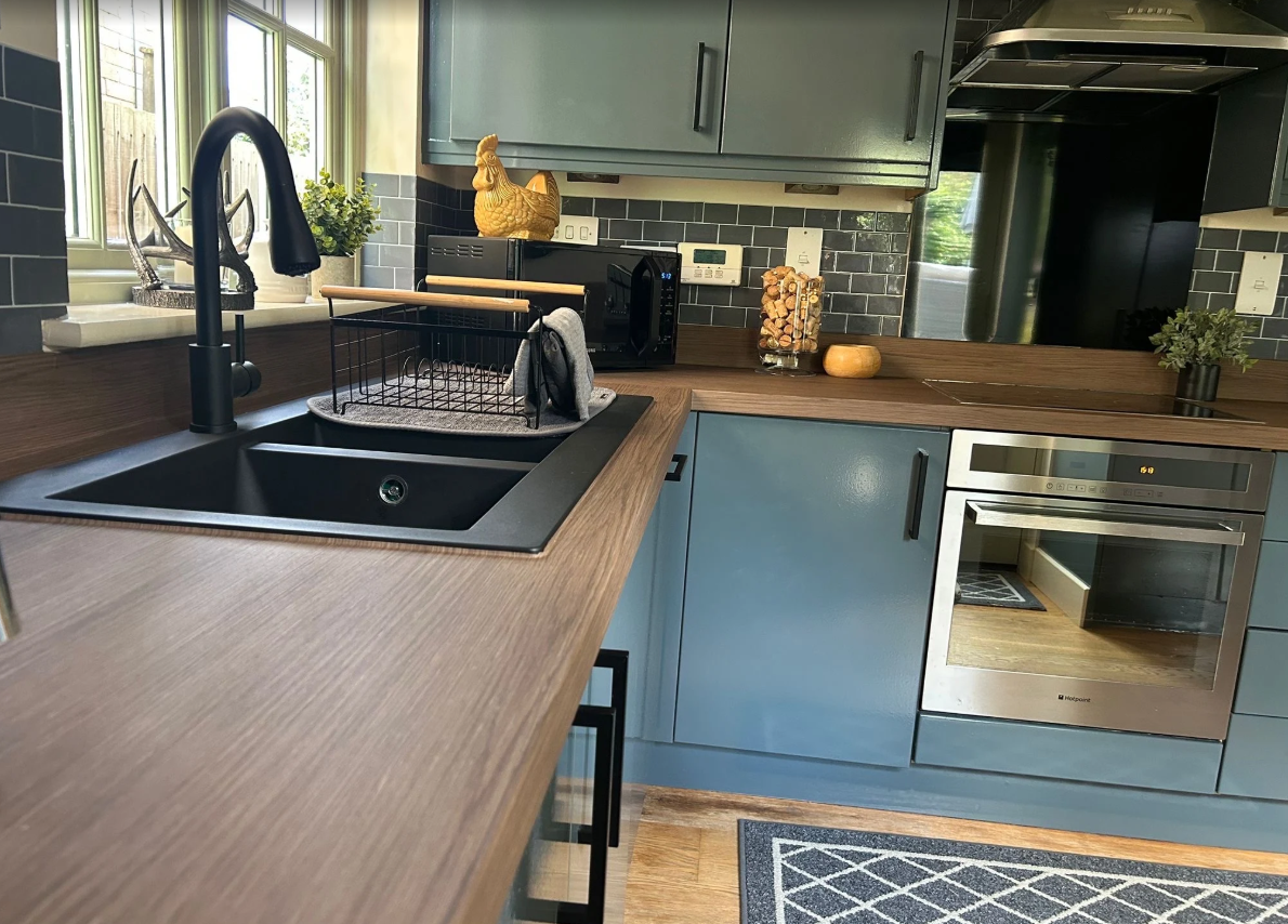 Black kitchen sink installation completed by Frosty Plumbing Co.